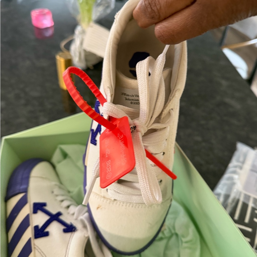 Off-White White Sneakers with Blue Accents and Red Tag